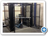 Goods Lift, with maximum working load 500kg, enclosed in a self-supporting mesh shaft. 